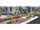 Modern home exterior with community playground, including a slide and climbing bars for the Gathering to enjoy at 48344 Orchid Ridge Ave # 104, Las Vegas, NV 89141