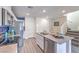 Modern kitchen features stainless appliances, gray counters and flooring, and a breakfast bar at 48344 Orchid Ridge Ave # 104, Las Vegas, NV 89141