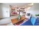 Open living and dining area with a kitchen view, perfect for modern living at 48344 Orchid Ridge Ave # 104, Las Vegas, NV 89141