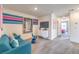 Comfortable living area with modern furnishings and access to bedroom at 48344 Orchid Ridge Ave # 104, Las Vegas, NV 89141