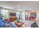 Open living area with dining space, modern decor, and lots of natural light at 48344 Orchid Ridge Ave # 104, Las Vegas, NV 89141