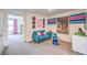 Cozy living room with colorful decor and accent wall, and comfortable seating at 48344 Orchid Ridge Ave # 104, Las Vegas, NV 89141