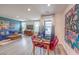 Open-concept living space with a dining area and comfortable living room arrangement at 48344 Orchid Ridge Ave # 104, Las Vegas, NV 89141