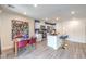 Open-concept area with modern kitchen, dining space, and sleek appliances at 48344 Orchid Ridge Ave # 104, Las Vegas, NV 89141