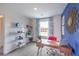 Stylish office showcasing a wooden desk, bright chair, and a window providing natural light at 48344 Orchid Ridge Ave # 104, Las Vegas, NV 89141
