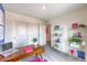 Inviting office area with a functional desk, colorful decor, and ample storage for organized work at 48344 Orchid Ridge Ave # 104, Las Vegas, NV 89141