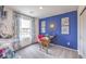 Well-lit office space with a desk, bright accent wall, and modern decor for a productive atmosphere at 48344 Orchid Ridge Ave # 104, Las Vegas, NV 89141