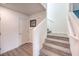 Carpeted staircase with white walls and railing leading to the upper level at 48344 Orchid Ridge Ave # 104, Las Vegas, NV 89141