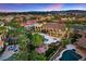 Expansive aerial view of the lush landscaped backyard and large pool surrounded by an upscale Las Vegas neighborhood at 5079 Mountain Top Cir, Las Vegas, NV 89148