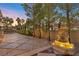 An outdoor water feature accentuates a serene backyard, offering a peaceful retreat with stone pavers and tasteful landscaping at 5079 Mountain Top Cir, Las Vegas, NV 89148
