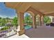 Spacious balcony overlooking the pool and lush gardens, providing a tranquil outdoor space at 5079 Mountain Top Cir, Las Vegas, NV 89148
