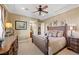 Relaxing bedroom features a ceiling fan, ensuite bathroom, and neutral color palette at 5079 Mountain Top Cir, Las Vegas, NV 89148