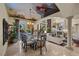 Open-concept dining room with bright lighting, fireplace and picturesque ceiling at 5079 Mountain Top Cir, Las Vegas, NV 89148