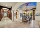 Elegant dining room with a decorative ceiling, chandelier, and access to outdoor views at 5079 Mountain Top Cir, Las Vegas, NV 89148