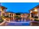 Circular driveway featuring an ornate water feature, manicured landscaping, and direct access to a spacious multi-car garage at 5079 Mountain Top Cir, Las Vegas, NV 89148