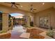 Covered outdoor living area with decorative tile, fans, and sunset views at 5079 Mountain Top Cir, Las Vegas, NV 89148