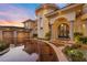 Majestic home featuring impressive architecture, pristine landscaping, and an inviting entrance at 5079 Mountain Top Cir, Las Vegas, NV 89148