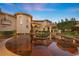 Elegant home exterior showcasing a circular driveway and lush landscaping at 5079 Mountain Top Cir, Las Vegas, NV 89148