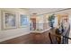 Upstairs hallway with wood floors, iron railing, and artwork at 5079 Mountain Top Cir, Las Vegas, NV 89148