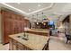 Open concept kitchen with an island, stainless steel appliances, and a seamless transition to the living area at 5079 Mountain Top Cir, Las Vegas, NV 89148