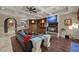 Cozy living room featuring a fireplace, built-in shelves, and a wet bar at 5079 Mountain Top Cir, Las Vegas, NV 89148