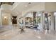 Elegant living room featuring a staircase, columns and archways, and marble floors at 5079 Mountain Top Cir, Las Vegas, NV 89148