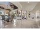 Bright living room with marble floors, fireplace, dining area, and picturesque ceiling at 5079 Mountain Top Cir, Las Vegas, NV 89148
