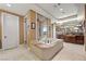 Beautiful main bathroom with a luxurious tub, walk-in shower, and dual sinks at 5079 Mountain Top Cir, Las Vegas, NV 89148