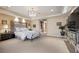 Luxurious main bedroom with a decorative headboard and chandelier lighting at 5079 Mountain Top Cir, Las Vegas, NV 89148