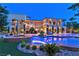 A luxurious pool with integrated spa, lush landscaping, and a multi-story home is ideal for outdoor enjoyment at 5079 Mountain Top Cir, Las Vegas, NV 89148