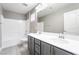 This bathroom features a double sink vanity and a shower-tub, perfect for busy families at 5981 Smith Valley Rd, Las Vegas, NV 89148