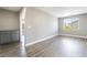 Spacious room featuring laminate floors, natural light, and gray cabinetry at 5981 Smith Valley Rd, Las Vegas, NV 89148