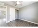 Cozy bedroom featuring wood-style laminate flooring and a convenient closet for storage at 5981 Smith Valley Rd, Las Vegas, NV 89148