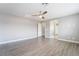 An expansive room with laminate floors and plenty of natural light is ready for your design at 5981 Smith Valley Rd, Las Vegas, NV 89148