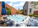 Inviting backyard hot tub with a modern deck, patio, and lush landscaping for relaxation and entertainment at 5981 Smith Valley Rd, Las Vegas, NV 89148