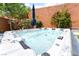 Inviting in-ground hot tub featuring multiple jets and seating at 5981 Smith Valley Rd, Las Vegas, NV 89148