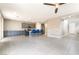 Open-concept kitchen boasts stainless appliances and bar seating, flowing into the living area at 5981 Smith Valley Rd, Las Vegas, NV 89148