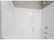 Shower-tub combination with white tile and chrome fixtures, providing a clean and modern aesthetic at 5981 Smith Valley Rd, Las Vegas, NV 89148