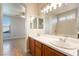 Bathroom featuring double sinks, a soaking tub and a walk-in shower at 6622 Black Oil Dr, Las Vegas, NV 89122
