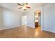 Empty room with tile floors, ceiling fan, and adjoining bathroom at 6622 Black Oil Dr, Las Vegas, NV 89122