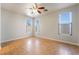 Empty room with three windows, tile floors, and ceiling fan at 6622 Black Oil Dr, Las Vegas, NV 89122