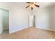 Bedroom featuring tiled floors, a ceiling fan, and access to a walk-in closet at 6622 Black Oil Dr, Las Vegas, NV 89122