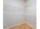 Walk-in closet featuring white shelving for clothing and accessories storage at 6622 Black Oil Dr, Las Vegas, NV 89122