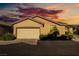 Charming single-story home featuring desert landscaping and a two-car garage at 6622 Black Oil Dr, Las Vegas, NV 89122