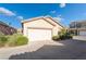 Charming single-story home featuring desert landscaping and a two-car garage at 6622 Black Oil Dr, Las Vegas, NV 89122