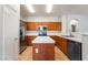 Spacious kitchen featuring wooden cabinets, stainless steel appliances, and a functional center island at 6622 Black Oil Dr, Las Vegas, NV 89122
