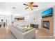 Staged living room with a fireplace, open layout, and tile floors at 6622 Black Oil Dr, Las Vegas, NV 89122