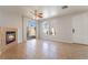 Inviting living room with neutral walls, tile flooring, and lots of natural light at 6622 Black Oil Dr, Las Vegas, NV 89122