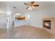 Bright living room featuring an open layout, tile floors, and a fireplace at 6622 Black Oil Dr, Las Vegas, NV 89122