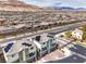Aerial view of modern homes with solar panels in a well-planned community and mountain backdrop at 6821 Prairie Pearl St, Las Vegas, NV 89148
